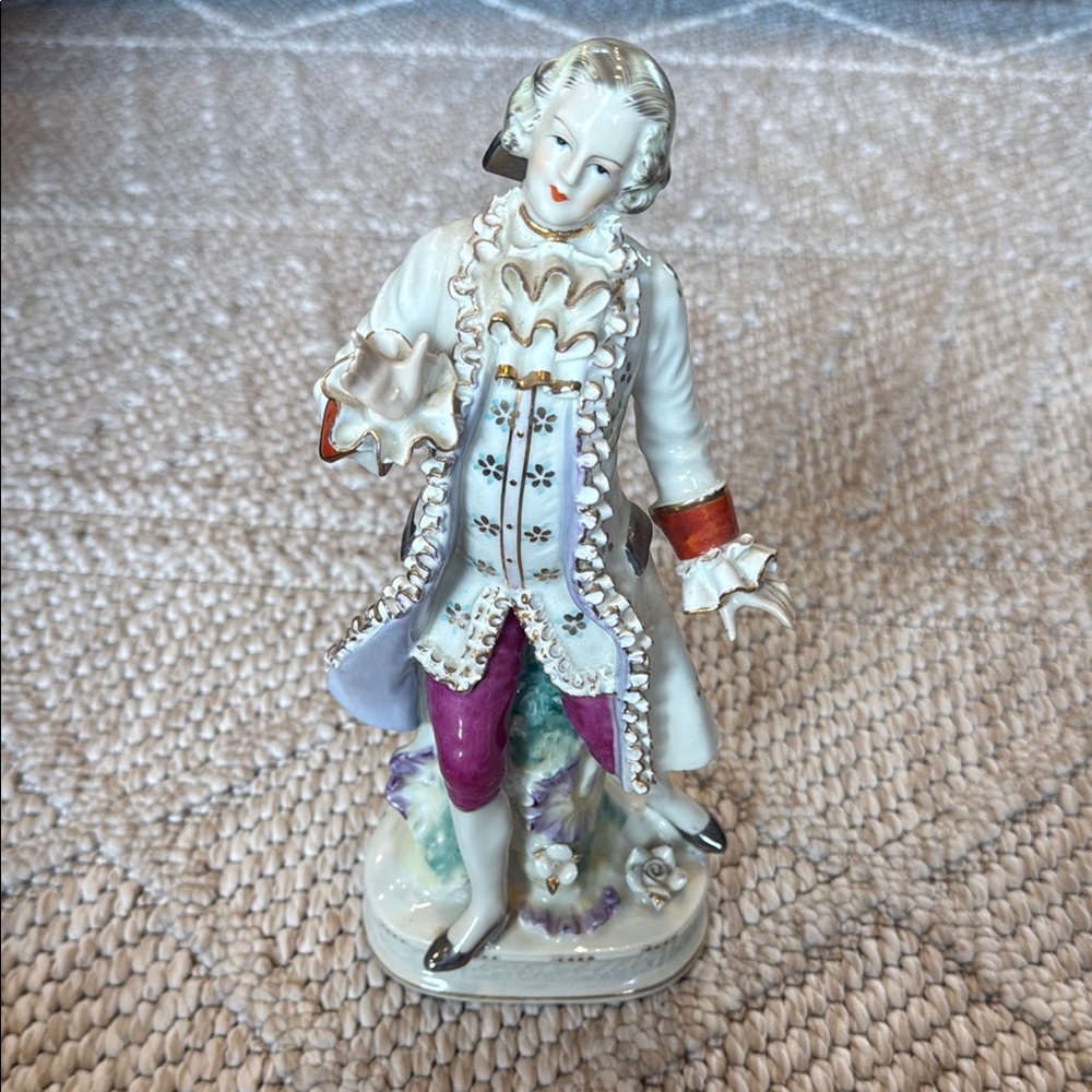 Porcelain Welch Figurine with Purple and Red Details